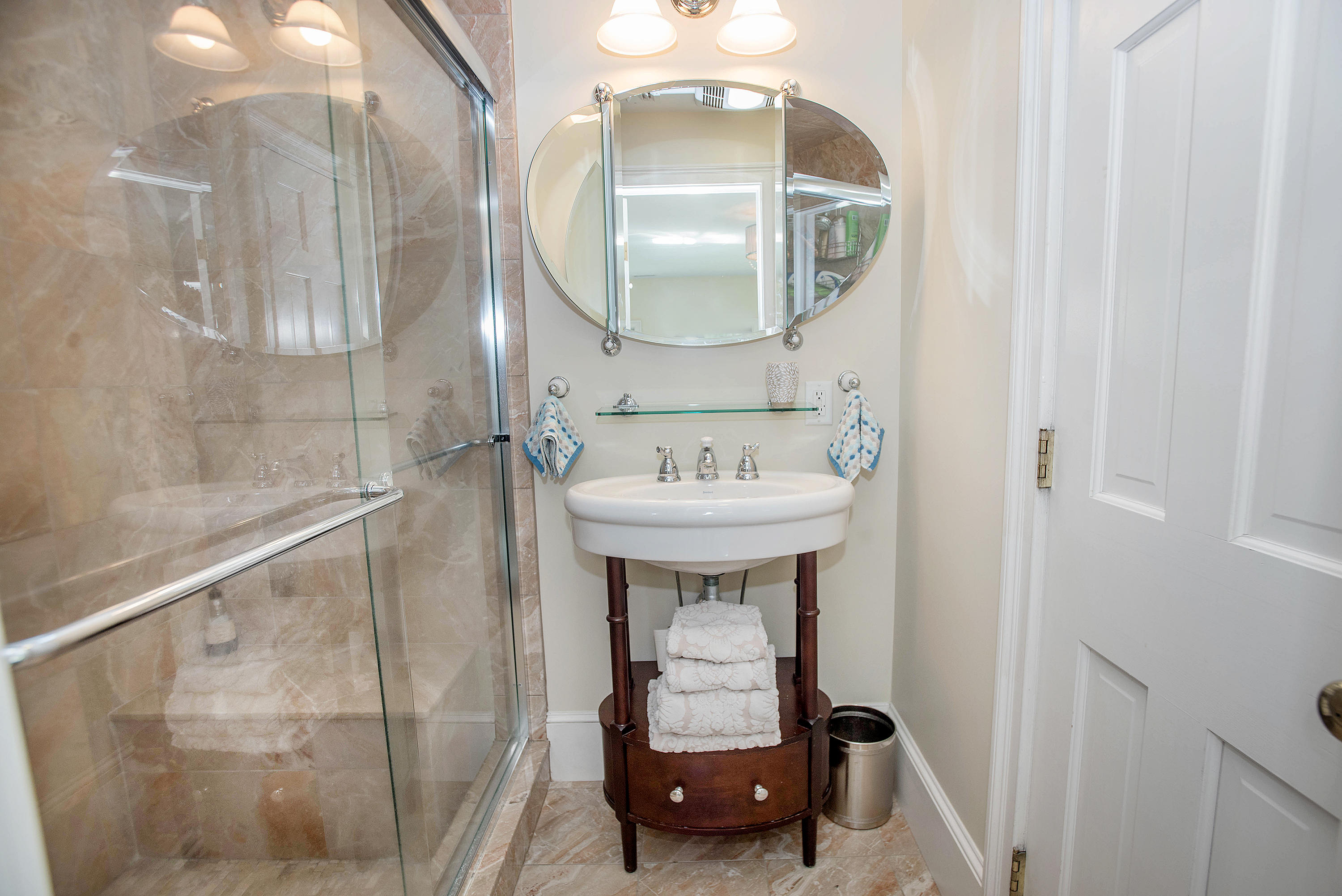 103 Jelliff Mill Road New Canaan, CT 06840 - Photo 20 of 30 a bathroom with a sink a mirror and vanity