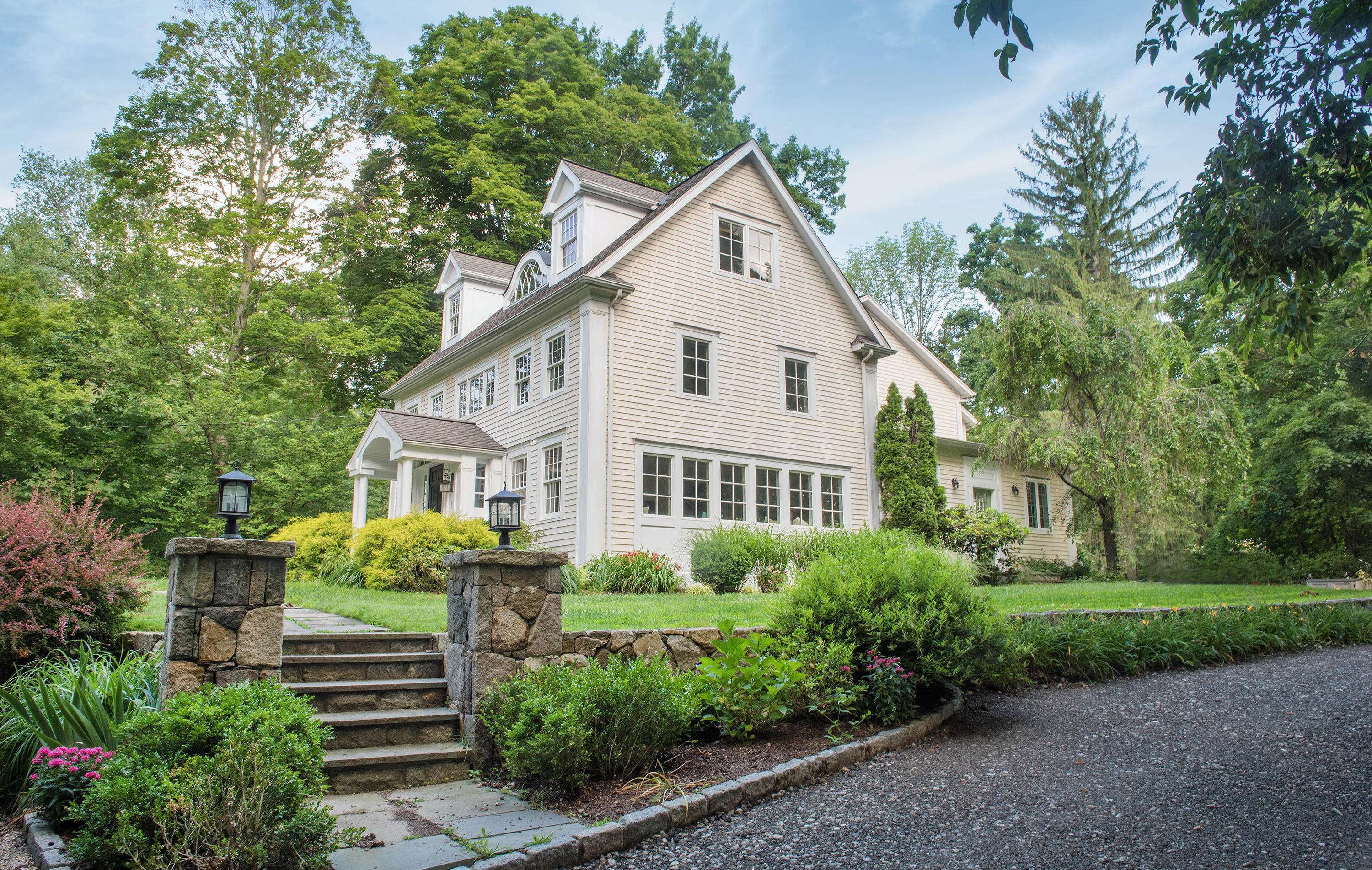 103 Jelliff Mill Road New Canaan, CT 06840 - Photo 2 of 30 a view of a house with yard and plants