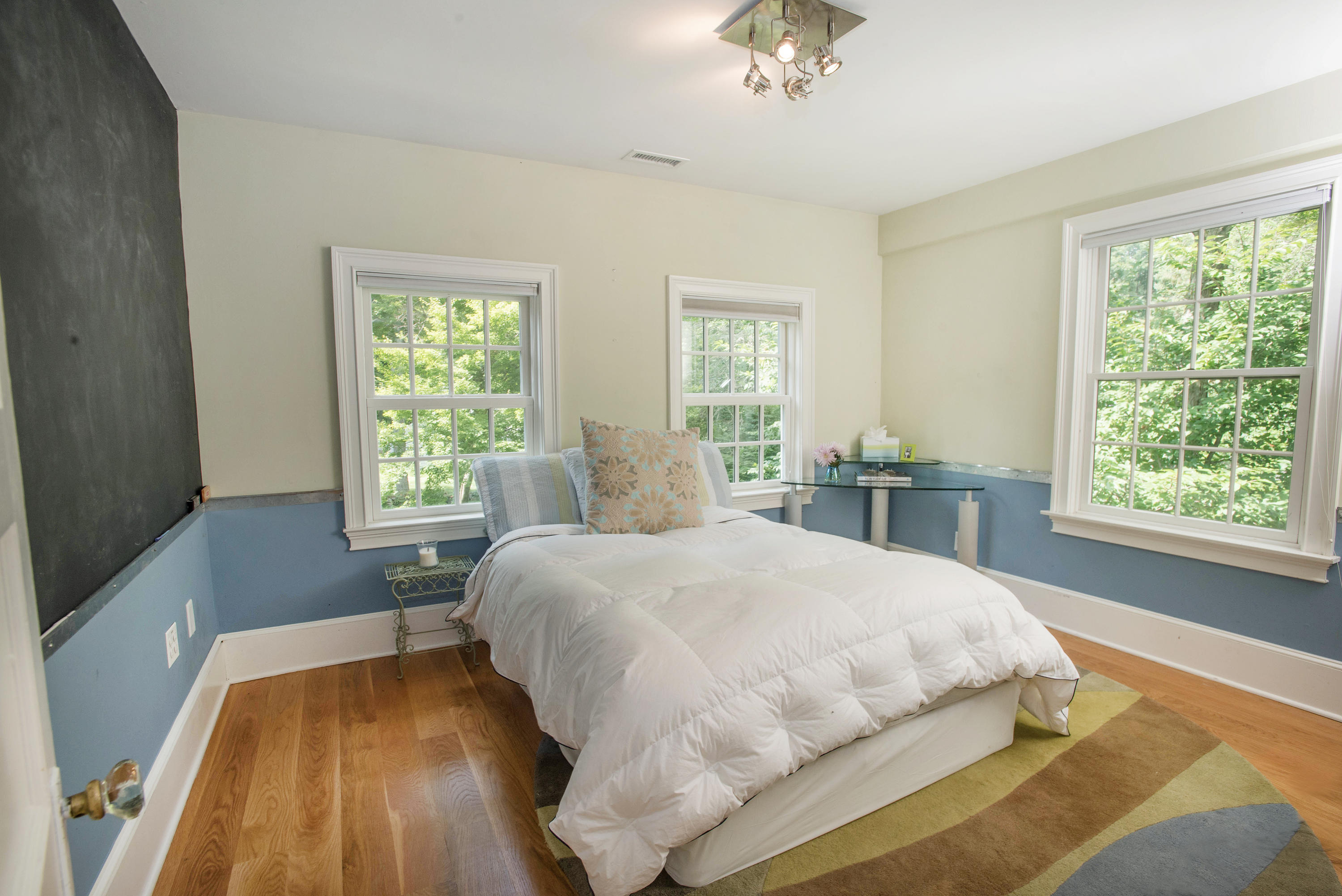 103 Jelliff Mill Road New Canaan, CT 06840 - Photo 21 of 30 a bed sitting in a bedroom next to a window