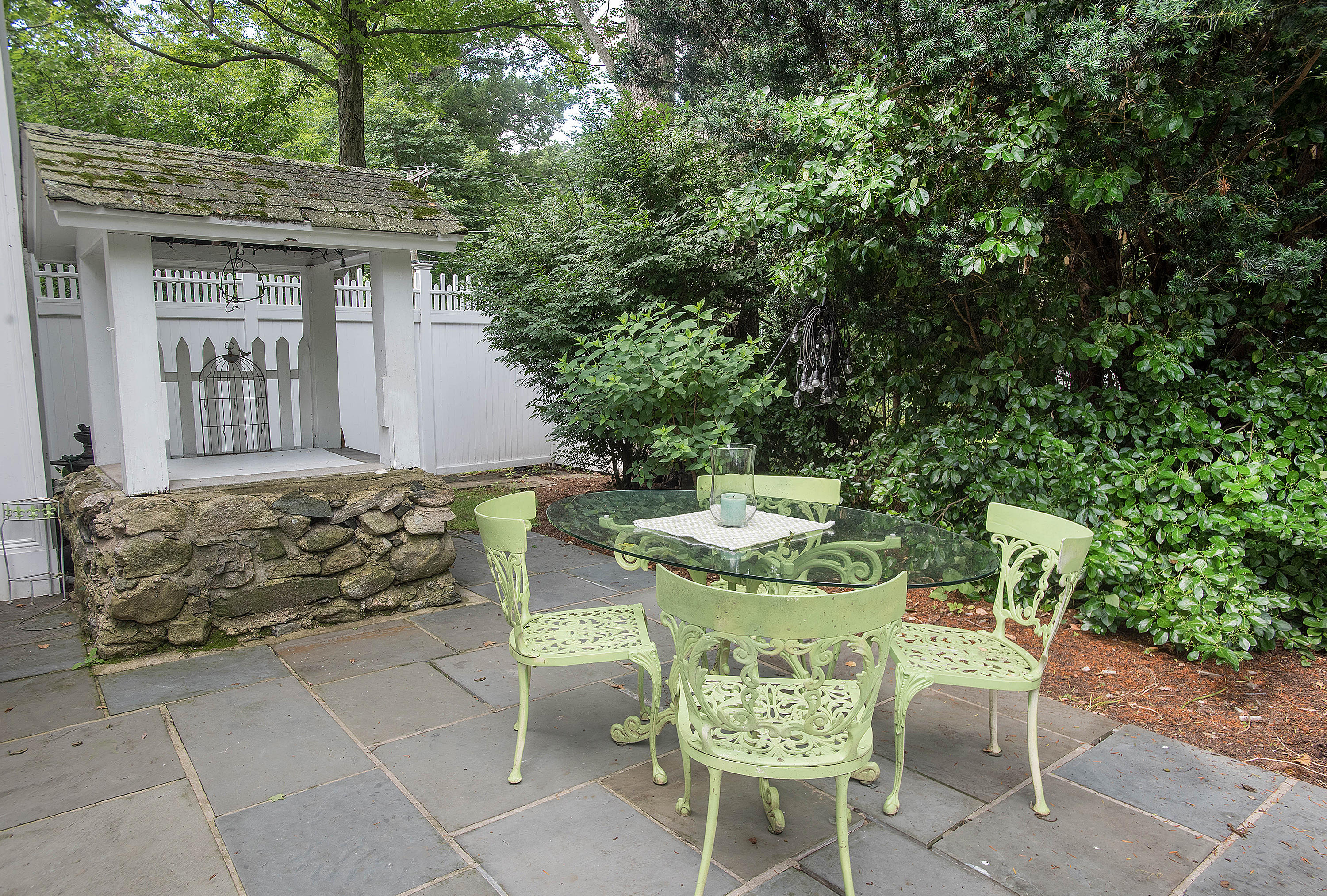 103 Jelliff Mill Road New Canaan, CT 06840 - Photo 26 of 30 a view of a patio with table and chairs and potted plants