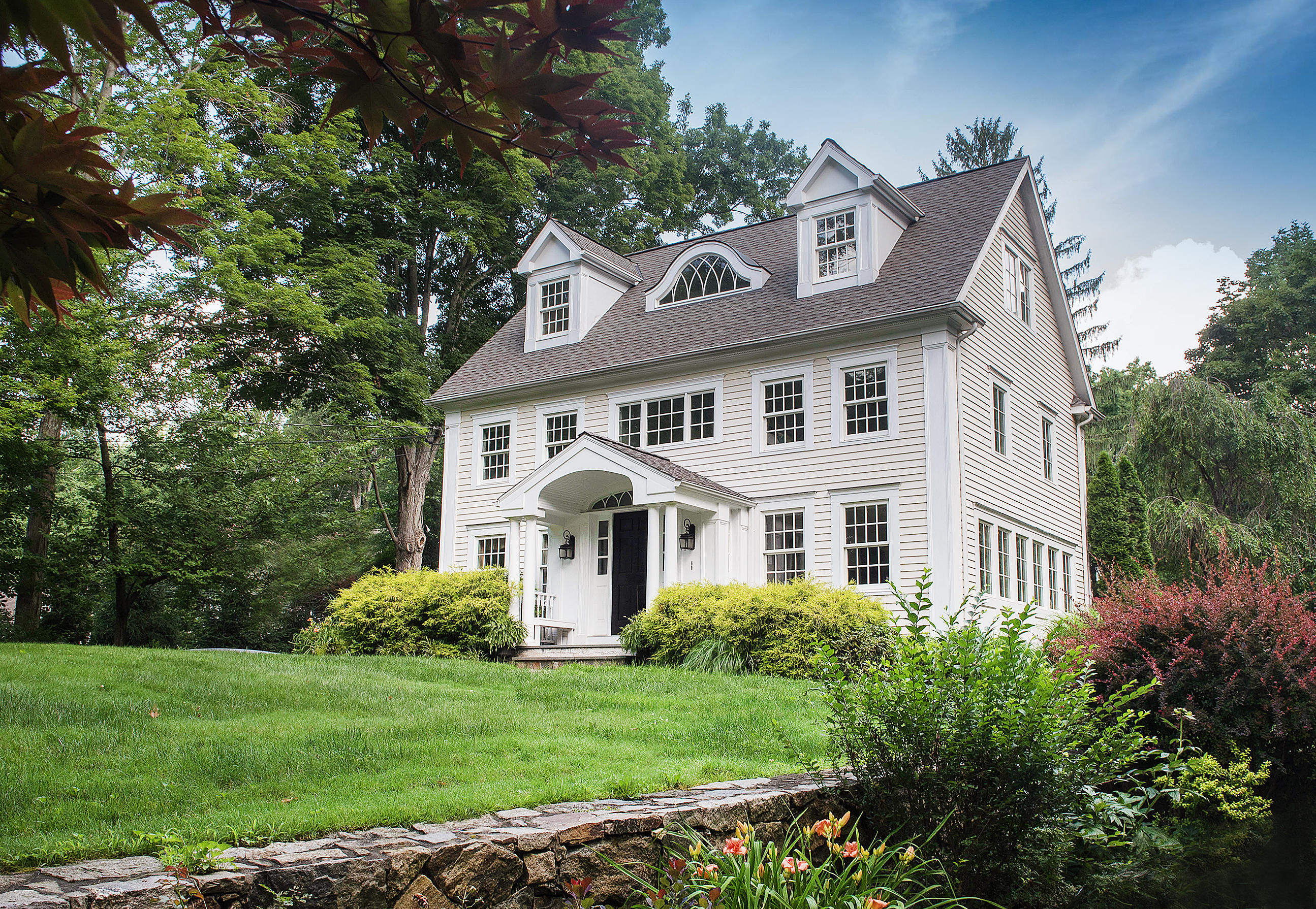 103 Jelliff Mill Road New Canaan, CT 06840 - Photo 29 of 30 a front view of a house with a yard