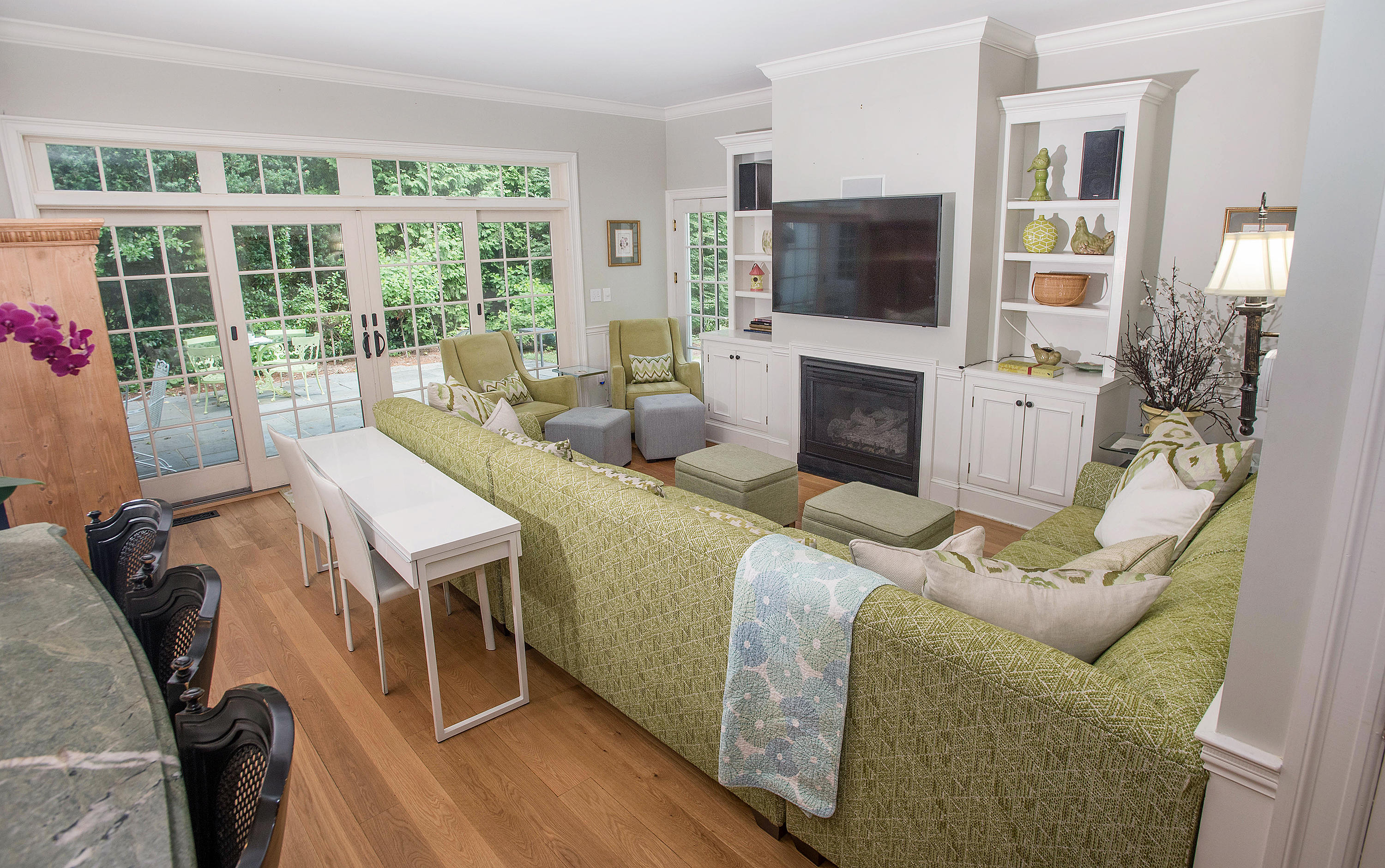 103 Jelliff Mill Road New Canaan, CT 06840 - Photo 4 of 30 a living room with furniture a flat screen tv and a fireplace