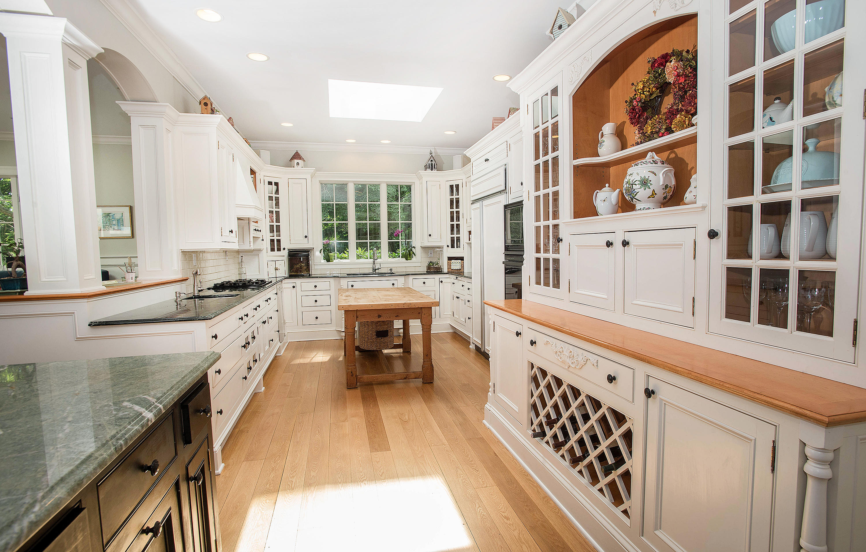 103 Jelliff Mill Road New Canaan, CT 06840 - Photo 6 of 30 a large white kitchen with a large window