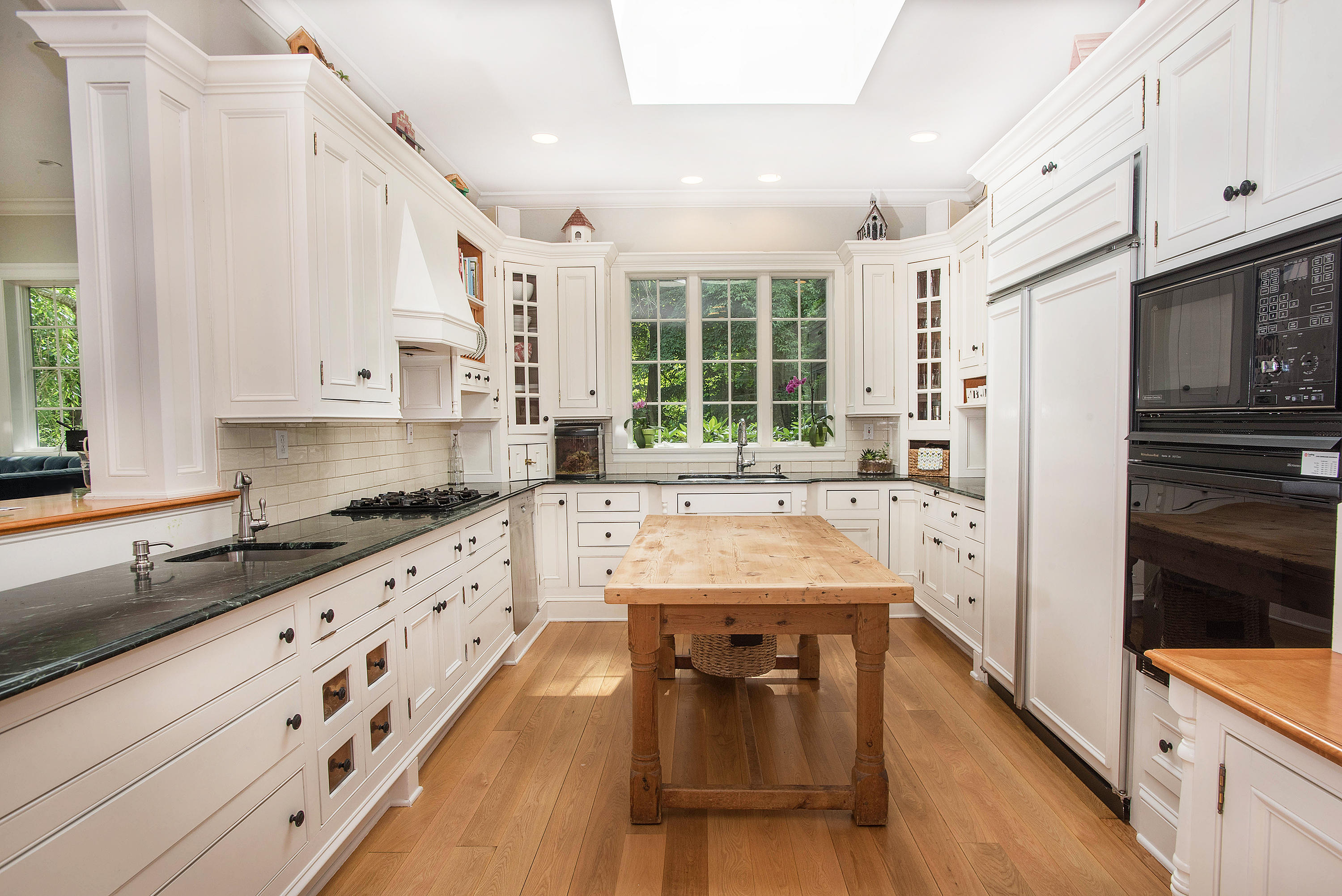 103 Jelliff Mill Road New Canaan, CT 06840 - Photo 8 of 30 a kitchen with stainless steel appliances granite countertop a sink stove and refrigerator