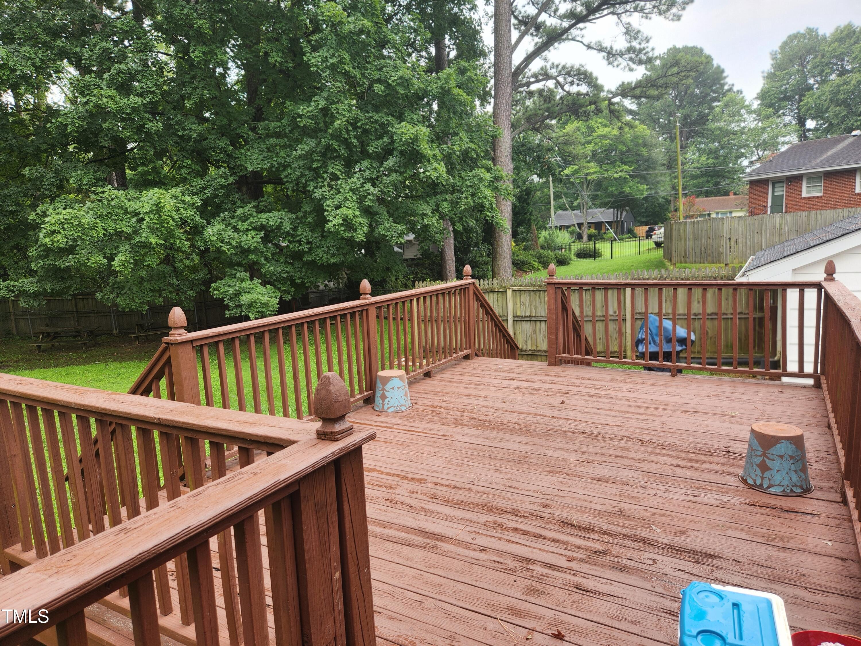 704 Donnelly Road Raleigh, NC 27610 - Photo 22 of 26 a balcony with wooden floor and fence