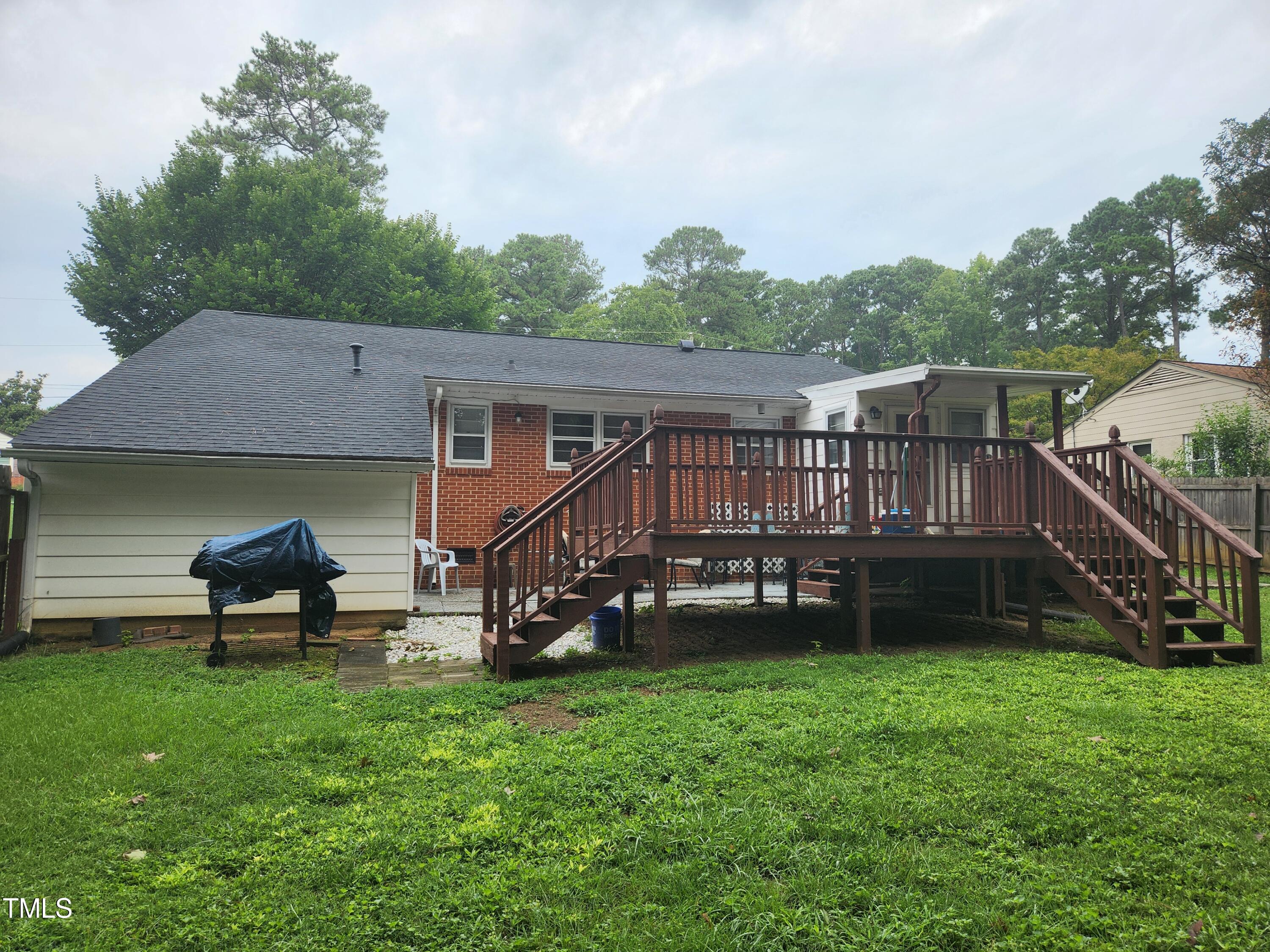 704 Donnelly Road Raleigh, NC 27610 - Photo 23 of 26 a view of house with a yard and sitting area