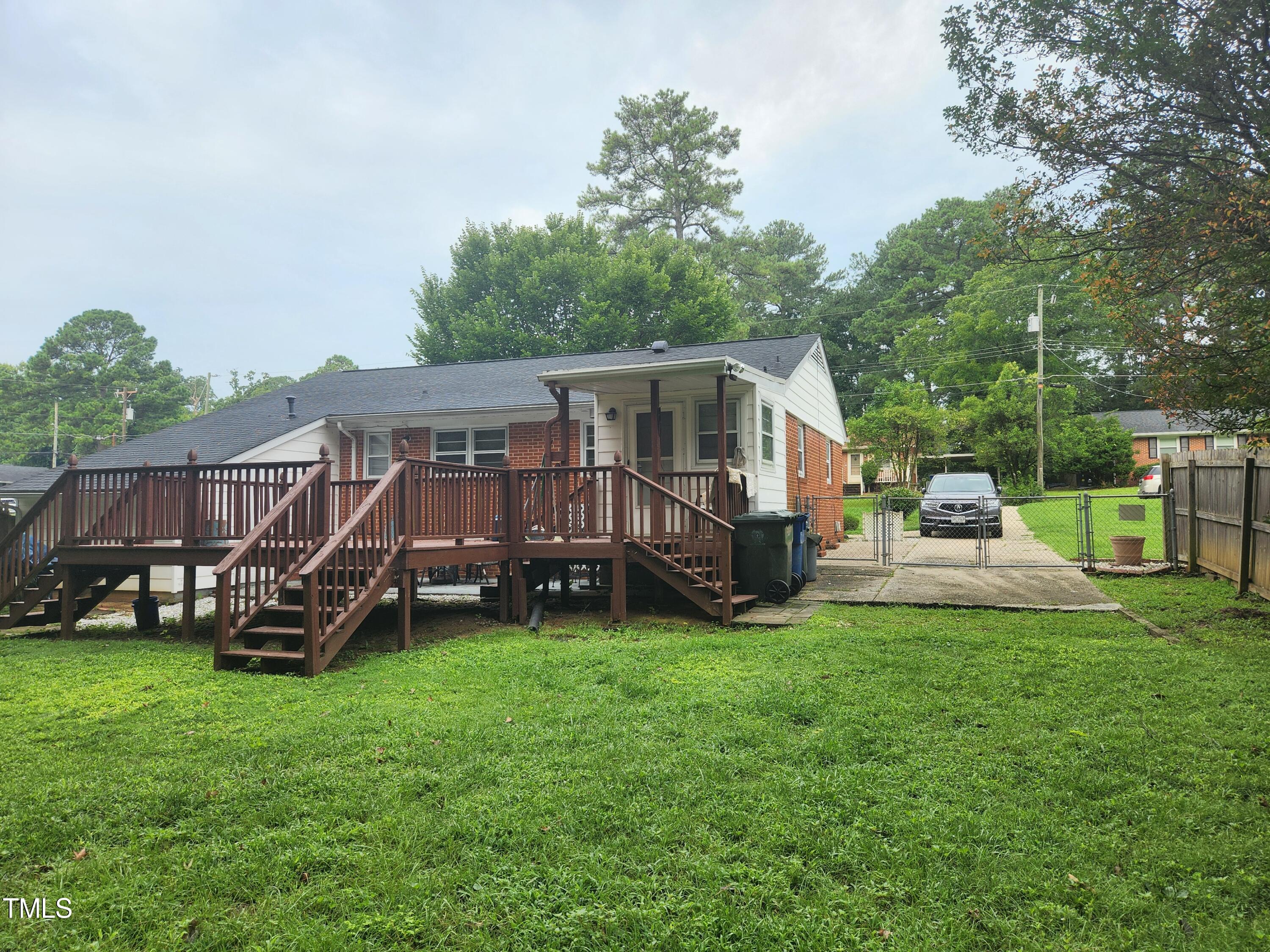 704 Donnelly Road Raleigh, NC 27610 - Photo 24 of 26 a view of a house with a yard and sitting area