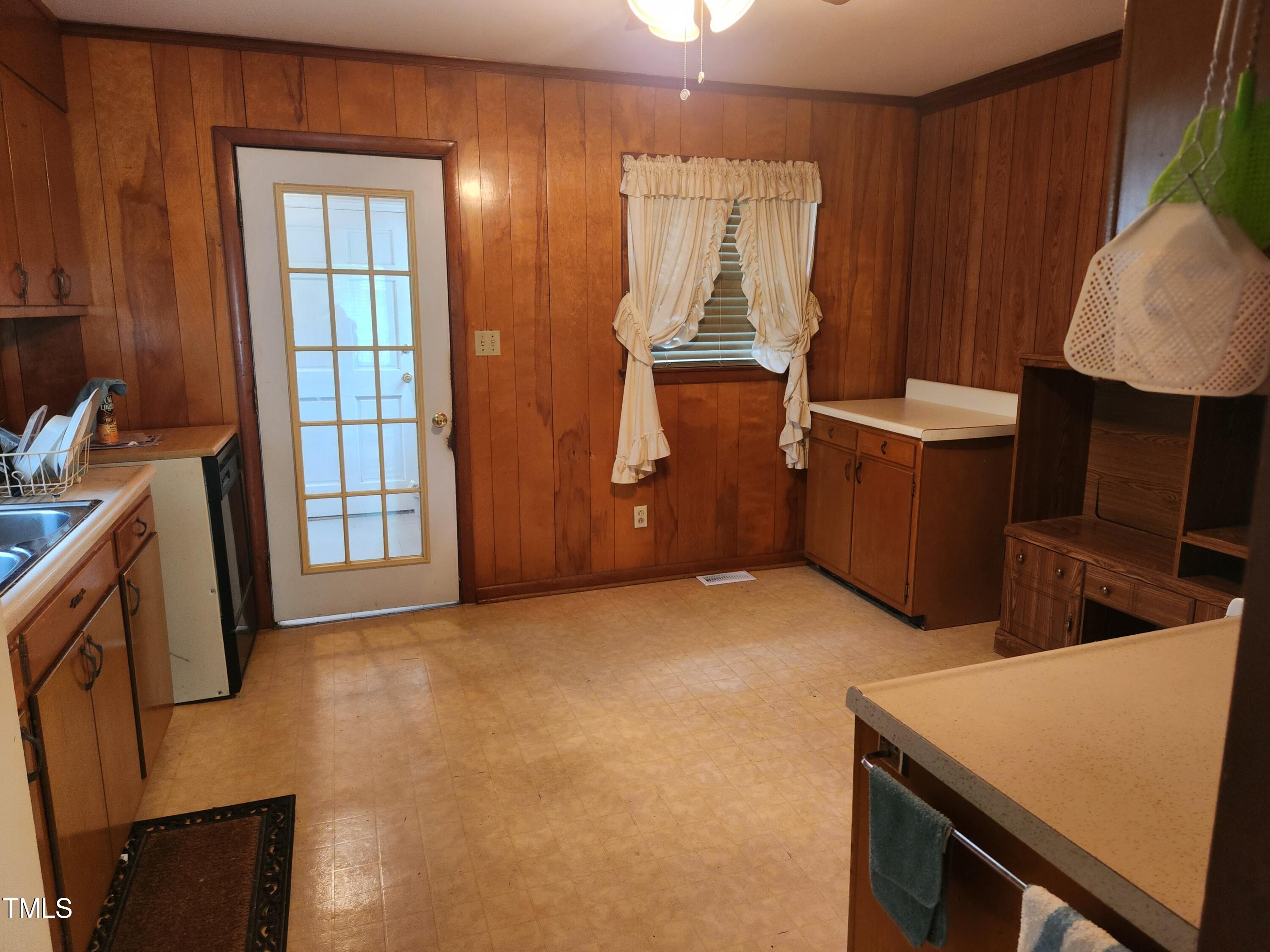 704 Donnelly Road Raleigh, NC 27610 - Photo 9 of 26 a view of storage and utility room with two washing machine
