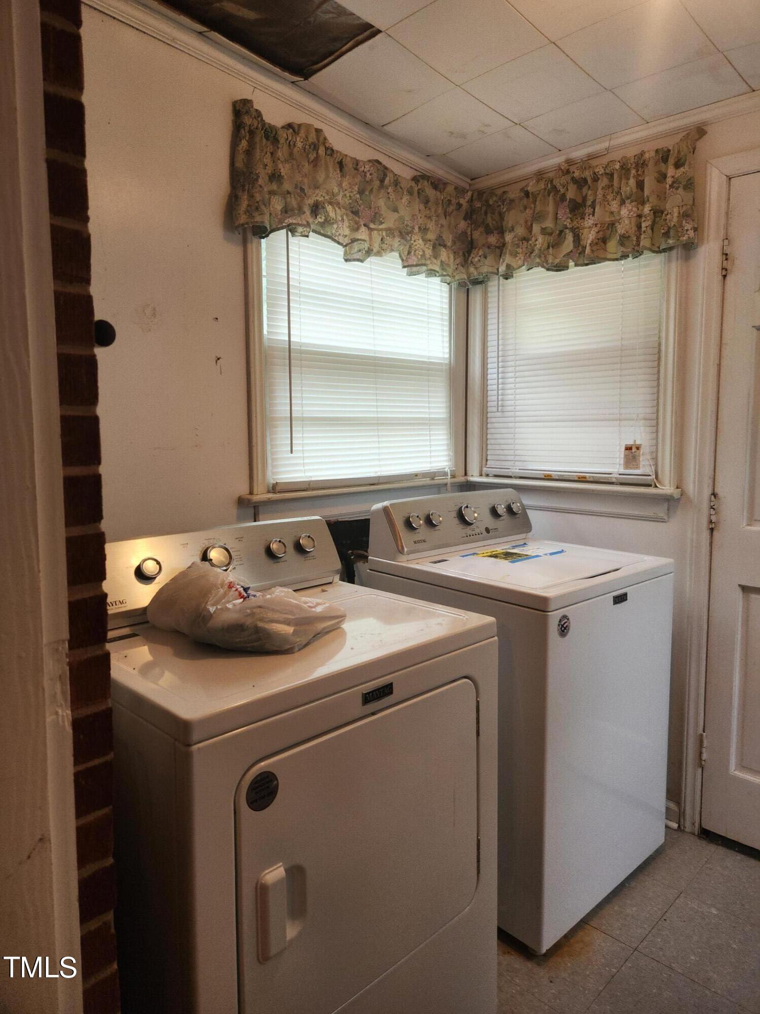 704 Donnelly Road Raleigh, NC 27610 - Photo 10 of 26 a utility room with dryer and washer