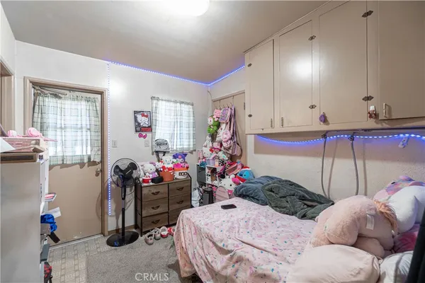 a bathroom with a sink mirror vanity and toilet