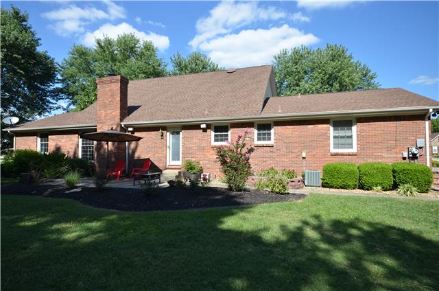 View of the back of the house, large patio nicely landscaped 