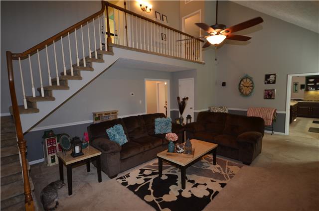 Great room with vaulted ceilings stairs going to the 2nd & 3rd bedroom