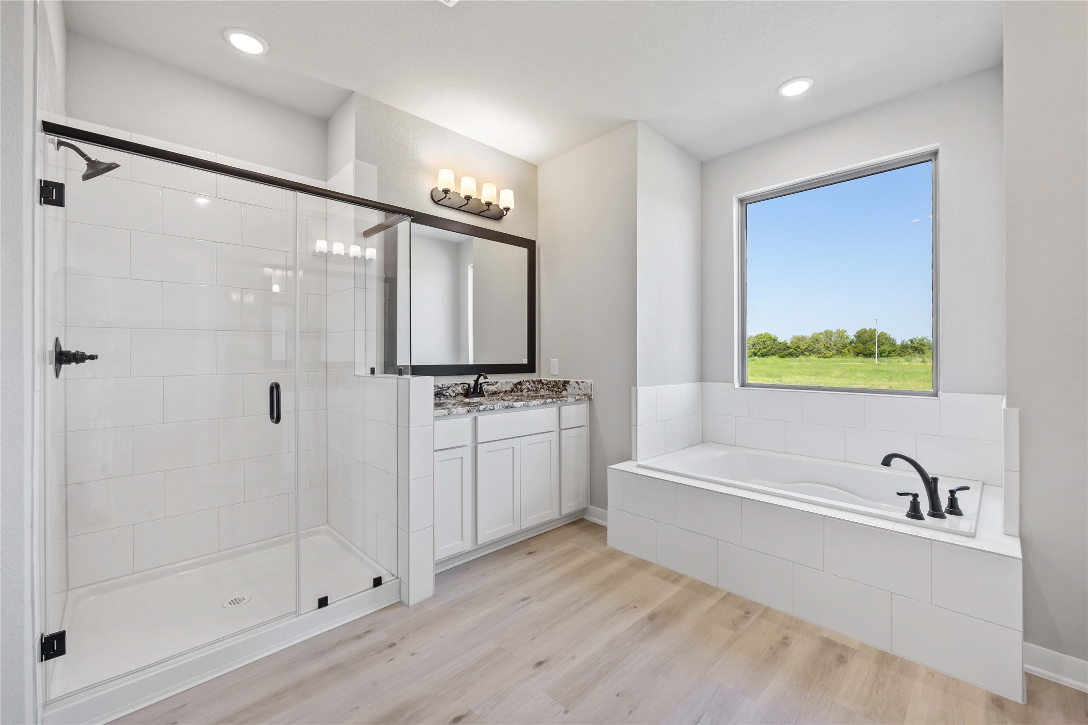 6702 Pelican Lane Beasley, TX 77417 - Photo 24 of 29 The luxurious owner's retreat is a private oasis with a spa-inspired bath and an extended walk-in closet.