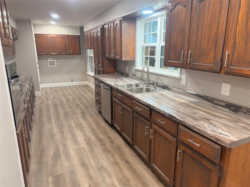 112 Myrtle Drive New Boston, TX 75570 - Photo 10 of 31 a kitchen with stainless steel appliances a sink stove and cabinets