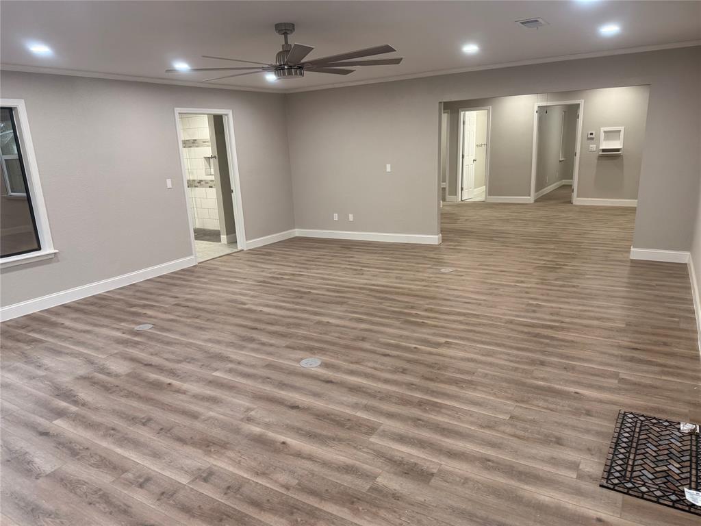 112 Myrtle Drive New Boston, TX 75570 - Photo 16 of 31 an empty room with wooden floor and windows