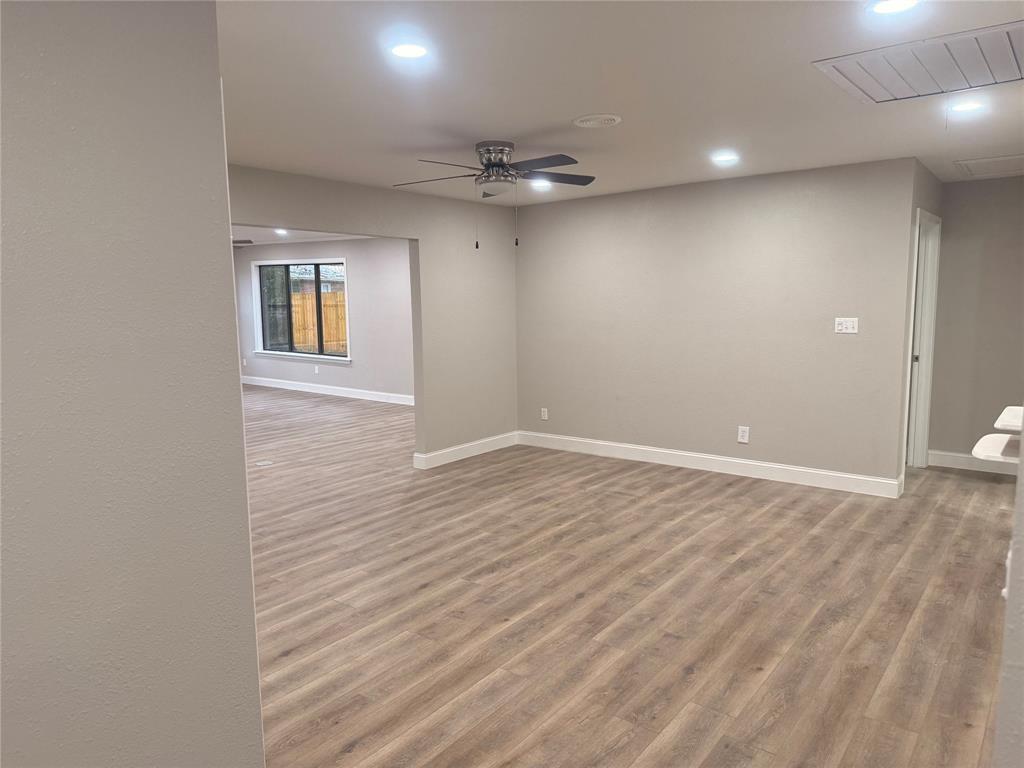 112 Myrtle Drive New Boston, TX 75570 - Photo 8 of 31 wooden floor in an empty room with a window