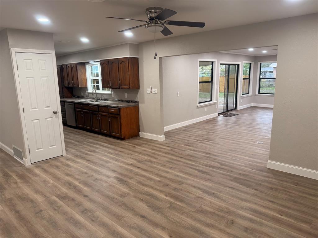 112 Myrtle Drive New Boston, TX 75570 - Photo 31 of 31 a large white kitchen with cabinets a sink and appliances
