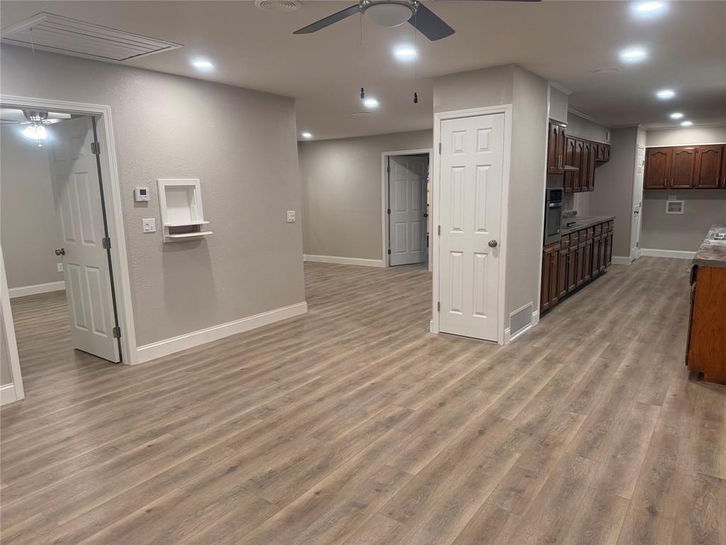 112 Myrtle Drive New Boston, TX 75570 - Photo 9 of 31 a view of a hallway with wooden floor