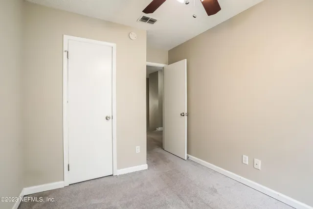 a view of a house with yard and plants