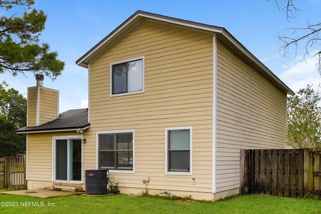 a picture of a bench in front of a wall
