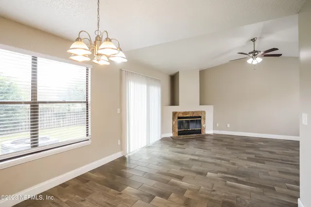 a view of a kitchen with a sink dishwasher and a refrigerator