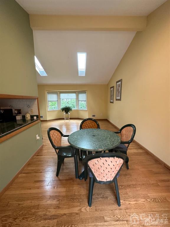 13 Parsons Road East Brunswick, NJ 08816 - Photo 17 of 39 a view of a dining room with furniture and wooden floor
