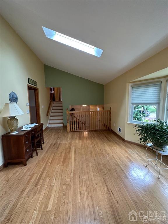 13 Parsons Road East Brunswick, NJ 08816 - Photo 18 of 39 a living room with furniture and wooden floor