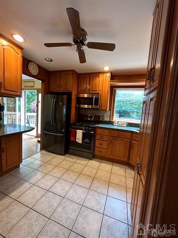 13 Parsons Road East Brunswick, NJ 08816 - Photo 19 of 39 a kitchen with stainless steel appliances a large counter top space appliances and a large window