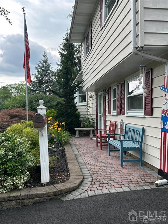 13 Parsons Road East Brunswick, NJ 08816 - Photo 2 of 39 a view of a patio with table and chairs with wooden fence