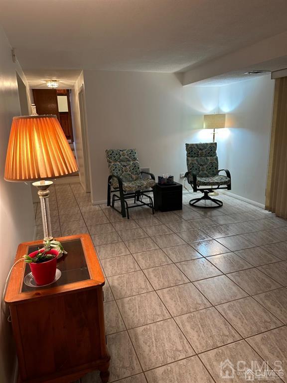 13 Parsons Road East Brunswick, NJ 08816 - Photo 27 of 39 a living room with pool table and a flat screen tv