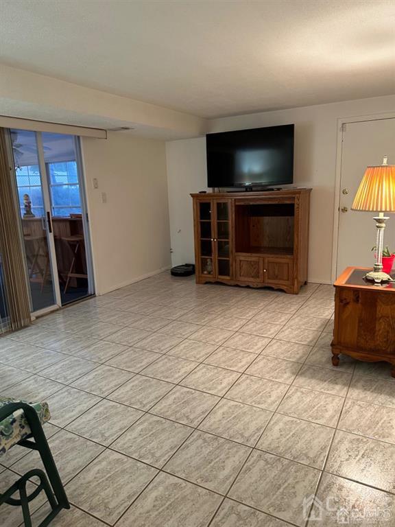 13 Parsons Road East Brunswick, NJ 08816 - Photo 29 of 39 a living room with furniture and a flat screen tv