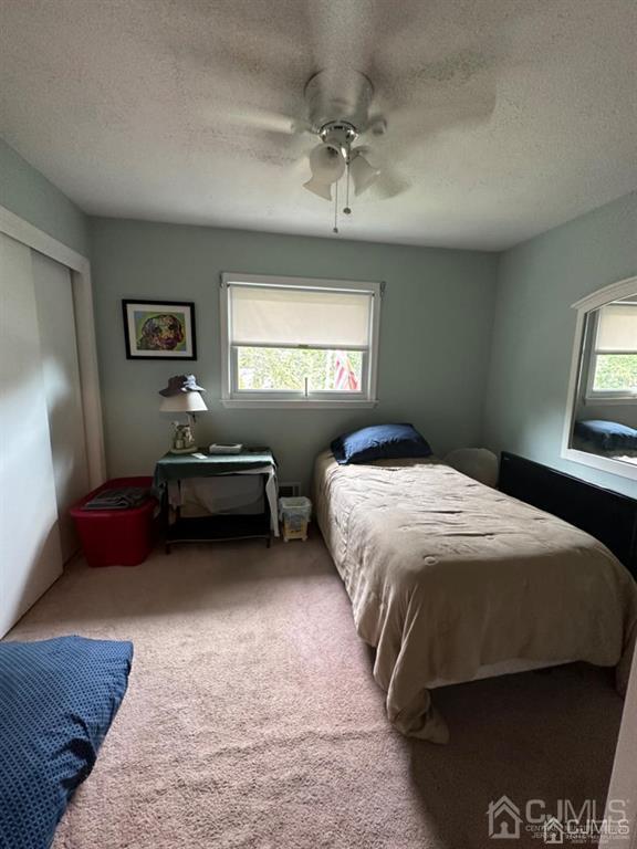13 Parsons Road East Brunswick, NJ 08816 - Photo 30 of 39 a spacious bedroom with a bed and window