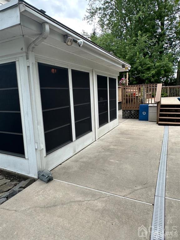 13 Parsons Road East Brunswick, NJ 08816 - Photo 39 of 39 a view of a house with a large window and wooden fence
