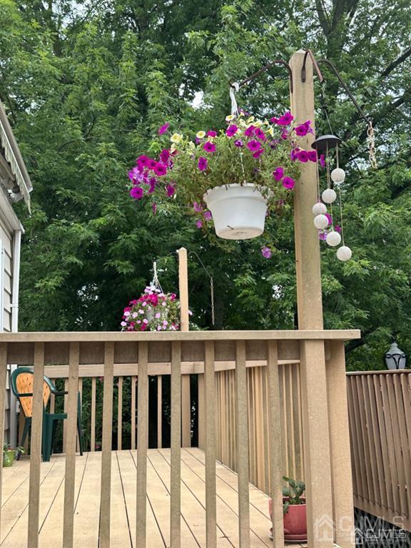 13 Parsons Road East Brunswick, NJ 08816 - Photo 7 of 39 a view of a potted flower in a yard along with fence