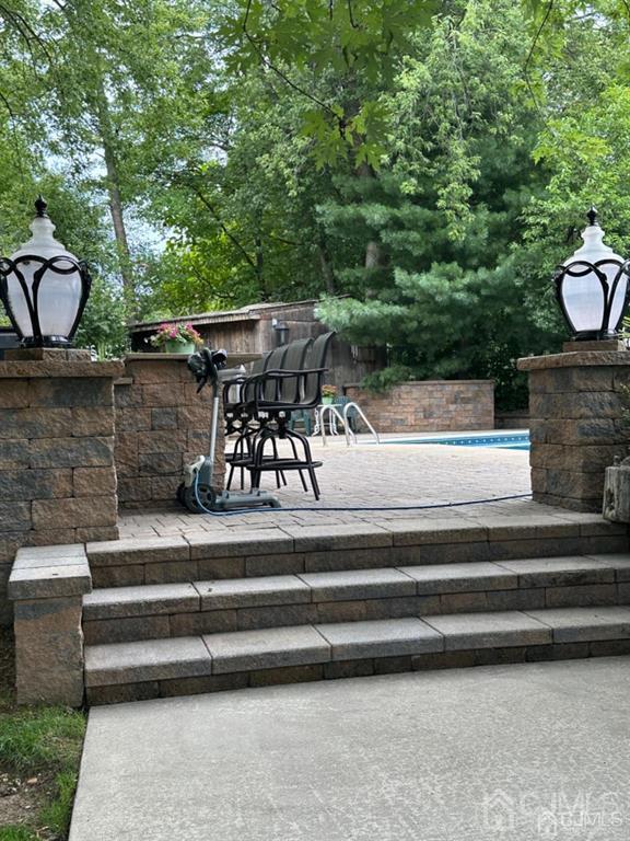 13 Parsons Road East Brunswick, NJ 08816 - Photo 8 of 39 a view of backyard with a fireplace