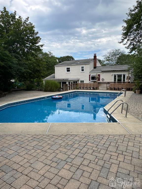 13 Parsons Road East Brunswick, NJ 08816 - Photo 9 of 39 a view of a house with backyard and sitting area
