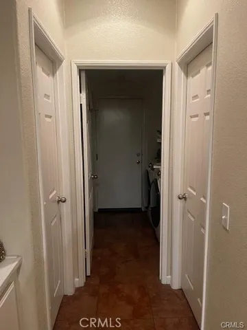 a view of a bathroom from a hallway