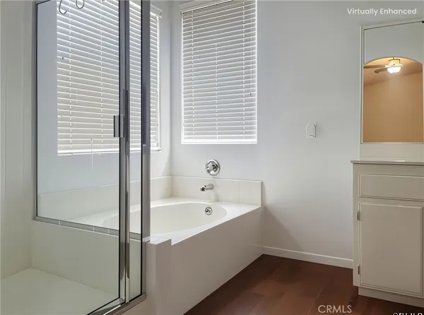 a bathroom with a bathtub and a sink