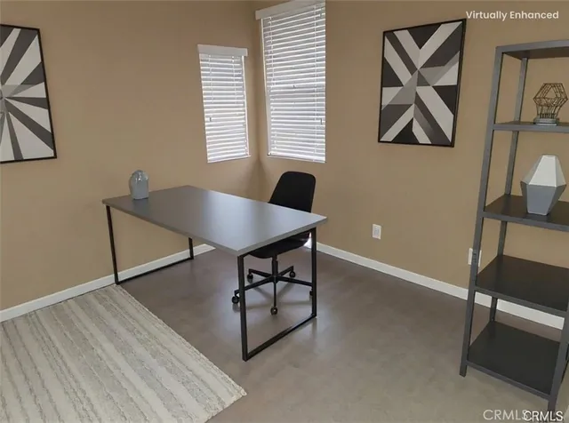 a workspace with furniture and window