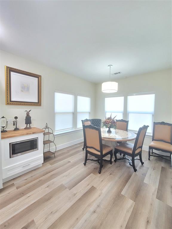 4825 Wichita Street Granbury, TX 76048 - Photo 13 of 30 a view of a a dining room with furniture window and wooden floor