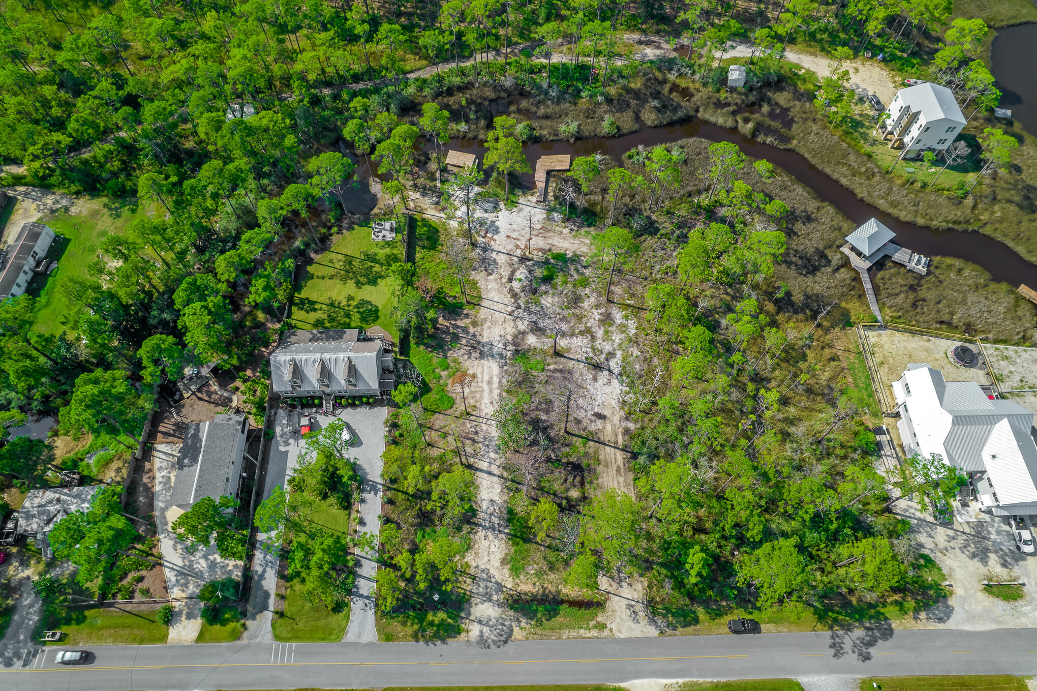 Lot 8 West Nursery Road Santa Rosa Beach, FL 32459 - Photo 3 of 11 an aerial view of residential house with outdoor space and trees all around
