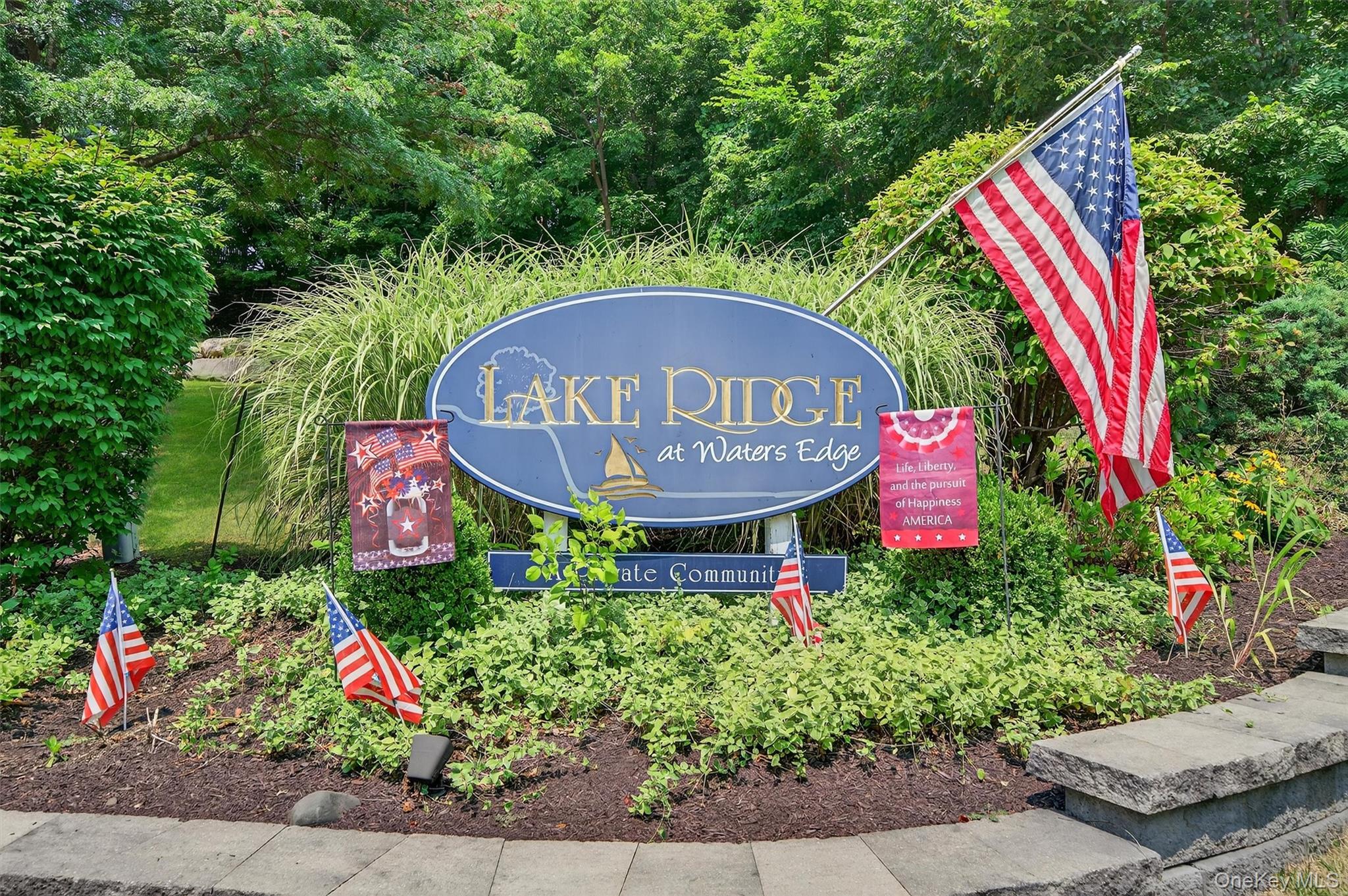 1 Lake Ridge Drive Middletown, NY 10940 - Photo 44 of 44 a sign that is in front of flowers