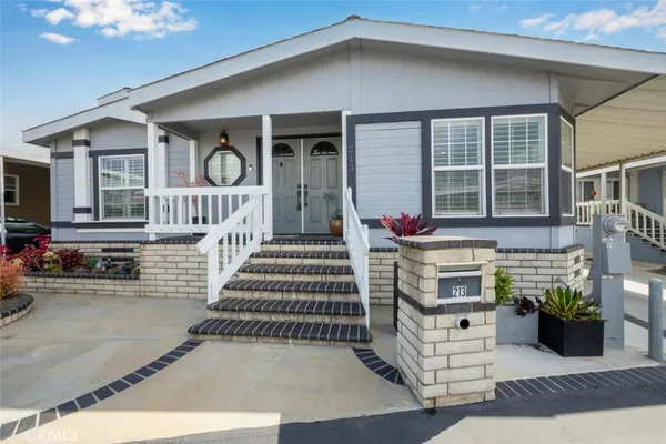 a front view of a house with a porch