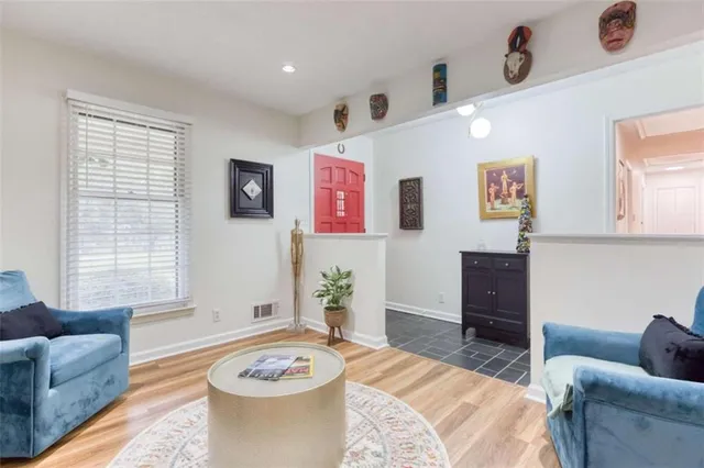 a living room with furniture and a window