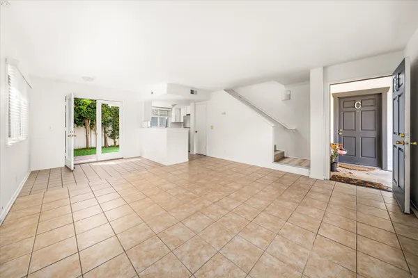 a view of empty room with windows