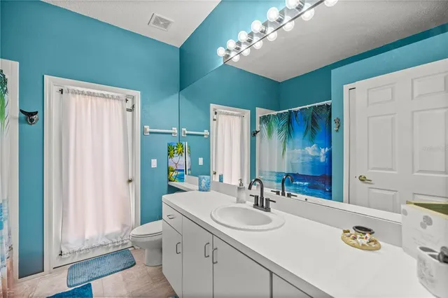 a bathroom with a sink double vanity and a mirror