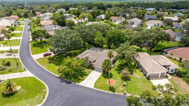 an aerial view of a house with a swimming pool