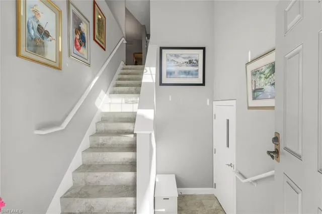 a view of a hallway with paintings on the wall
