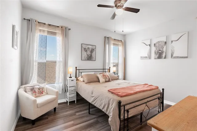 a bedroom with a bed and a couch