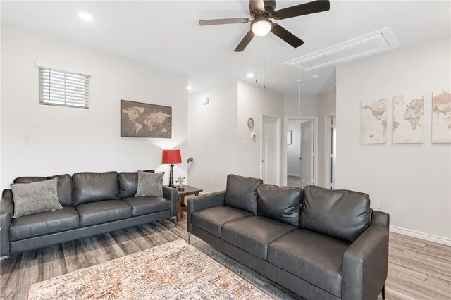 a living room with furniture and a rug